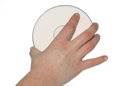 Photo of a hand holding blank CDの写真素材