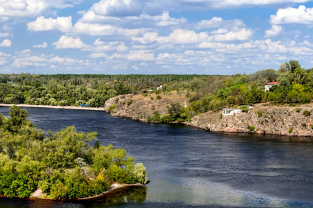 Summer landscape with river and cloudy sky