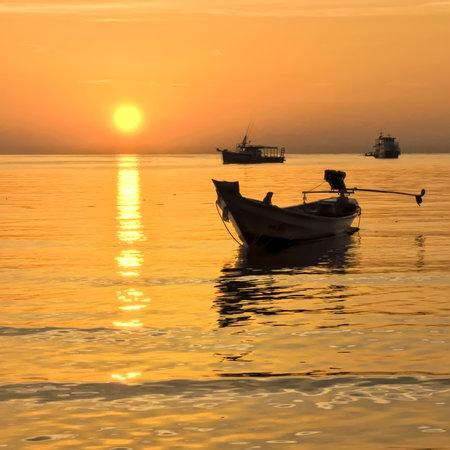 Long-tail at Gold Sunset, Thailand の写真素材