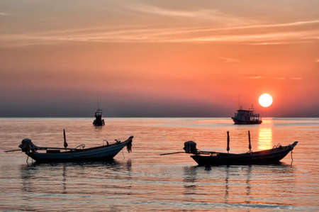 Long tailed boat Ruea Hang Yao at sunset in Krabi Thailand.の写真素材