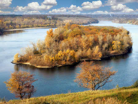 Scenic view of autumn island and river. Ukraineの写真素材