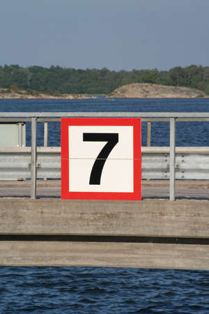 A sign with the number seven on itの写真素材