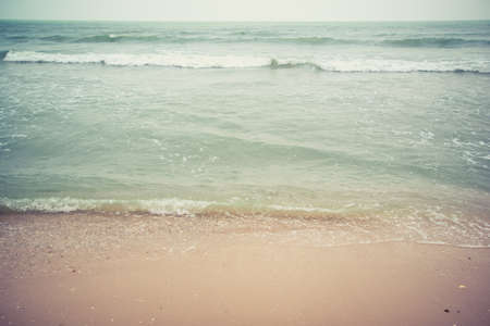 sand sea water and wave in vintage styleの写真素材
