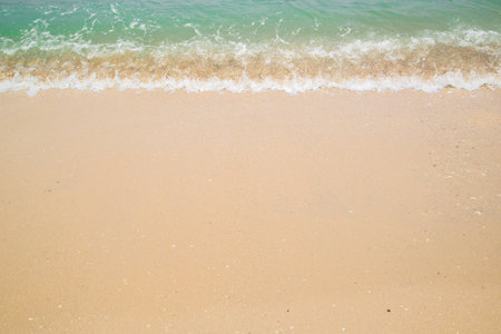Wave and sand (water on the beach)