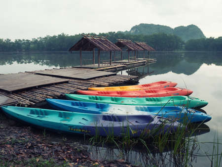 colorful boat,colorful canoeing and raft on water in retro styleの写真素材