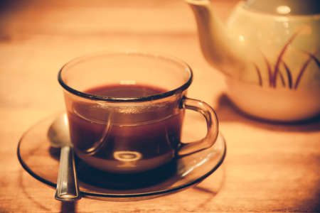 tea or coffee on wooden table in retro styleの写真素材