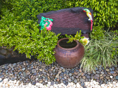 Blank label wooden in beautiful garden and stone textureの写真素材