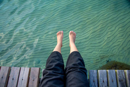 lying feet to the sea for relaxeの写真素材