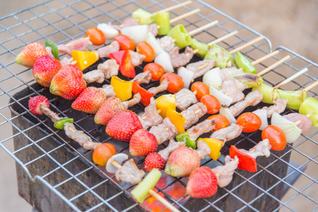 meat and vegatable barbeque wih strawberry on the grill