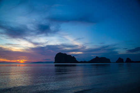Beautiful sunset and silhouette mountain or silhouette island in Thailandの写真素材