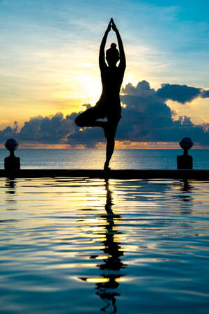 beautiful shape of body yoga at sunset.の写真素材