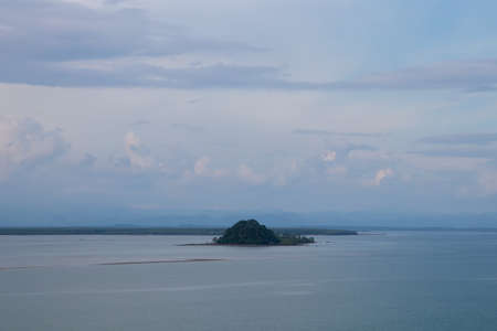 Simple island on sea and blue sky.の写真素材