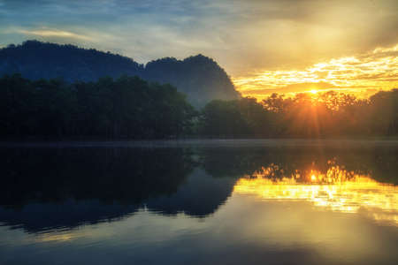 reflection of sunlight and lake in Thailand.の写真素材