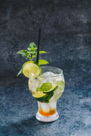 Mojito cocktail with lime and mint on loft backgroundの写真素材