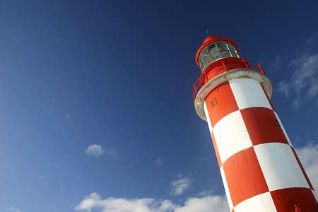 Lighthouse Under a Deep Blue Sky.の写真素材