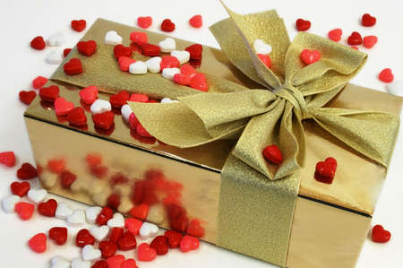 Wrapped Gift Surrounded by Shaped Candiesの写真素材