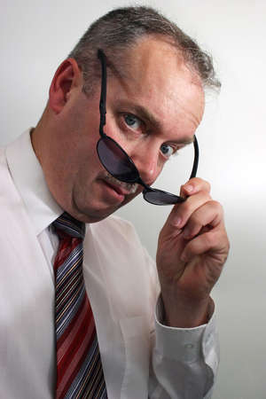 Businessman Taking Sunglasses Offの写真素材