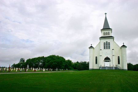 Country Church and its Cemetery Under a Stormy Skyの写真素材
