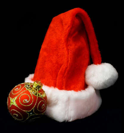 Christmas Ball and Santa's Hatの写真素材