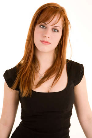 A beautiful young redhead lady isolated on whiteの写真素材