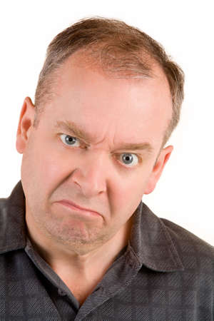 Portrait of a grumpy middle aged man.の写真素材