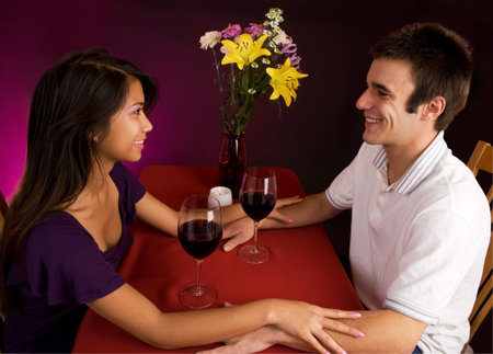 Couple Getting Closer While Having Wineの写真素材