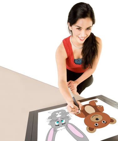 Woman Drawing on a Digital Tabletの写真素材