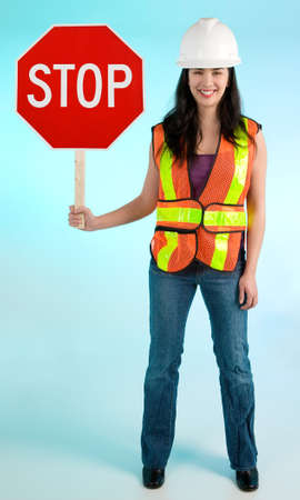 Conceptual Smiling Construction Lady Worker Stopping you For Somethingの写真素材