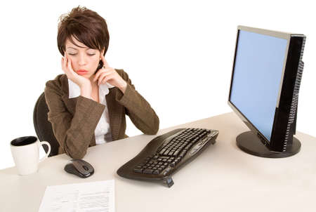 Serious Businesswoman Working at her Deskの写真素材