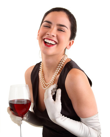 Beautiful Woman Holding a Glass of Wine and Laughingの写真素材