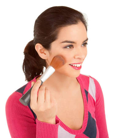 Young Woman Powdering her Cheekの写真素材