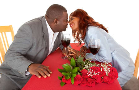 African American Couple About to Kiss in Romantic Dinnerの写真素材