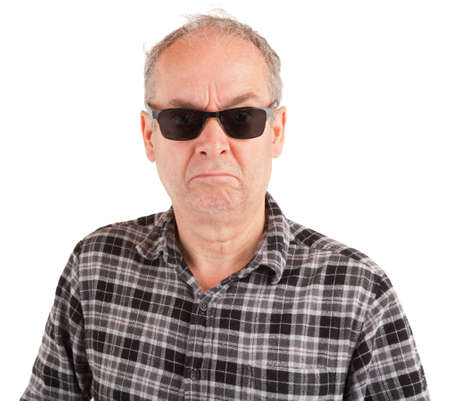 A disgruntled guy is wearing sunglassesの写真素材