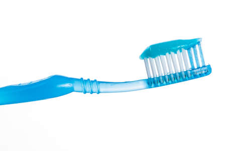 One toothbrush with toothpaste over white background  Studio isolatedの写真素材