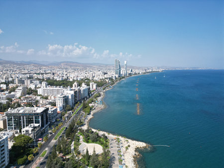 Coastal view of Limassol with modern buildings and clear blue sea on a sunny dayの写真素材