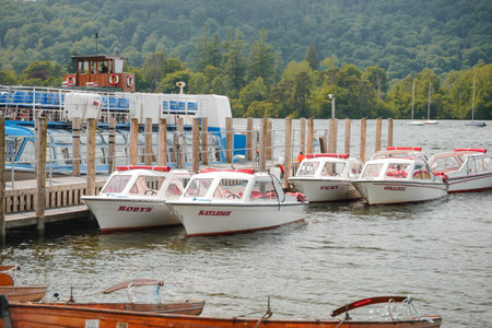 Scenic boating activity at a marina with docked pleasure boats in a tranquil lakeside settingの写真素材
