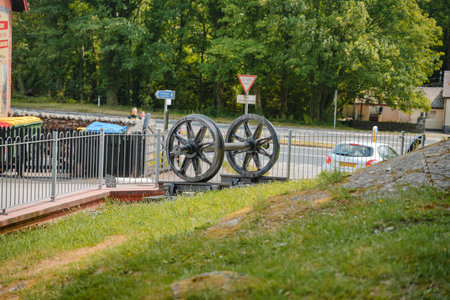 Historic cannons displayed near roadside in a lush green areaの写真素材