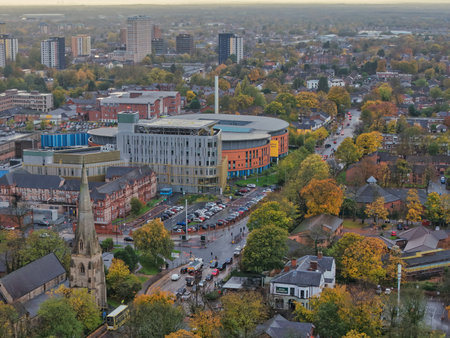 Cityscape view showcasing urban development alongside nature in the fall seasonの写真素材