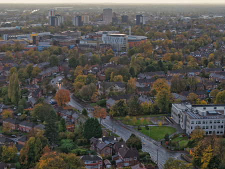 Vibrant cityscape view showing autumn foliage and urban architecture in the heart of a bustling communityの写真素材