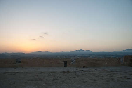 Sunset in mountains with a trashの写真素材