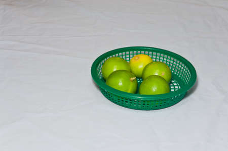 Green lemon on white background.の写真素材