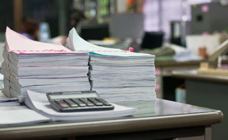 Document on desk in work office.Soft focus.の写真素材