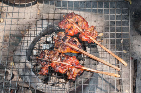 Chicken grill on fire for lunch.(Soft focus.)の写真素材