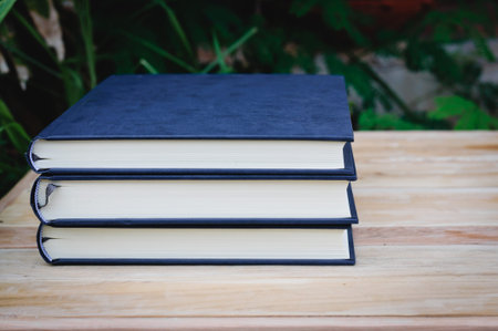 Old book on wood desk,soft focus.