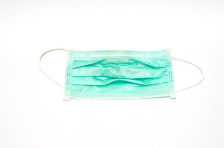 Old medical mask put on white background.の写真素材