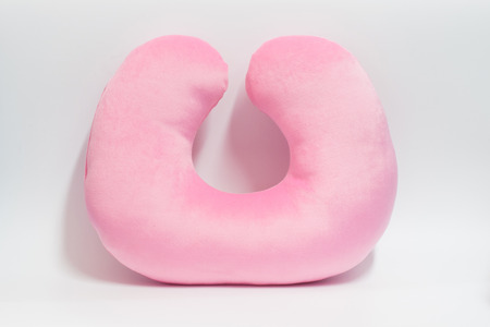 Pink neck pillow on white background.の写真素材