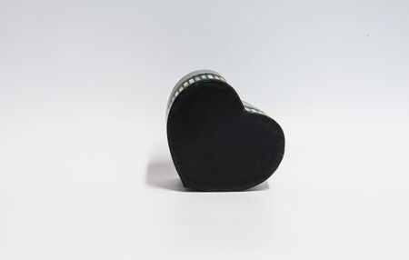 Black heart shape box on white background.の写真素材