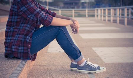 Young woman sitting for relax in park,selective focus.の写真素材