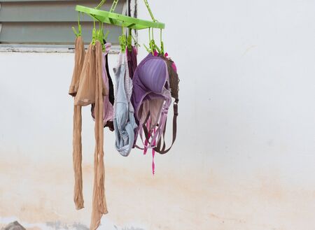 Underwear of female on hangers out room,selective focus.の写真素材