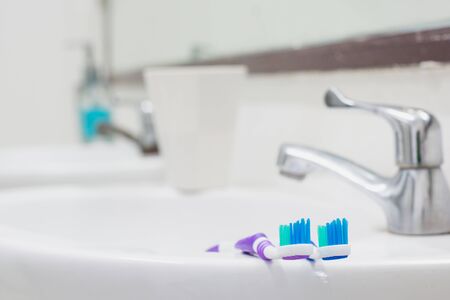 Toothbrush in toilet and selective focus.の写真素材